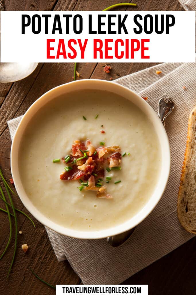 white bowl of creamy beige soup topped with bacon on top of light brown linen tablecloth on wood table