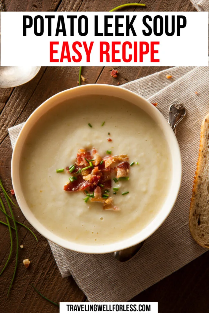 white bowl of creamy beige soup topped with bacon on top of light brown linen tablecloth on wood table