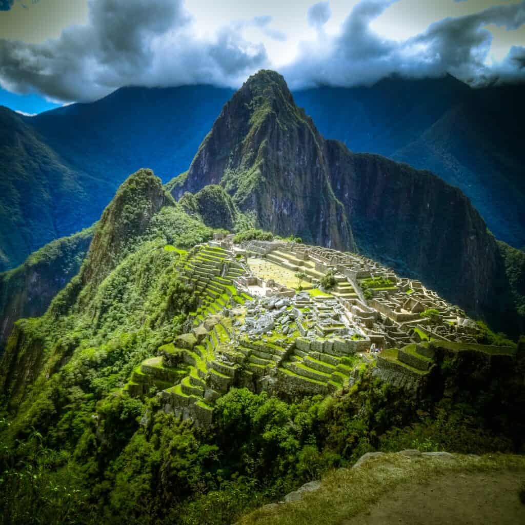 green mountains with staircased view of ancient city, aerial photo of Macchu Picchu, Peru, 