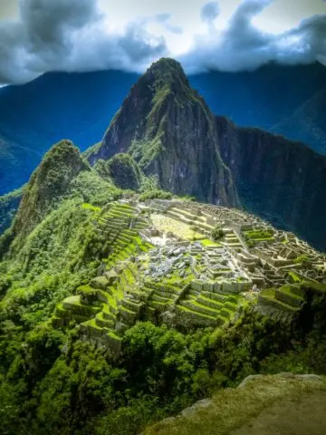 green mountains with staircased view of ancient city, aerial photo of Macchu Picchu, Peru,
