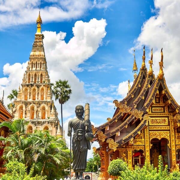 standing statue and temples landmark during daytime photo in Thailand