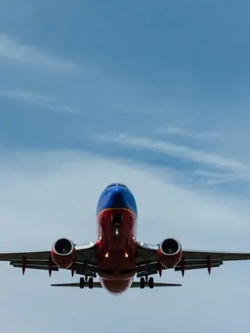 large blue and orange plane flying