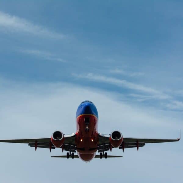 large blue and orange plane flying