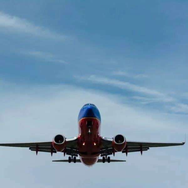 large blue and orange plane flying