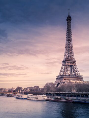 tall pointy triangular metal tower near river at sunset, Eiffel Tower, Paris France