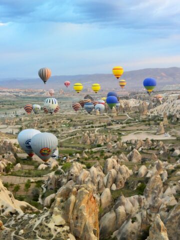 photo of assorted-color air balloon lot in mid air during daytime, Cappadocia Turkey