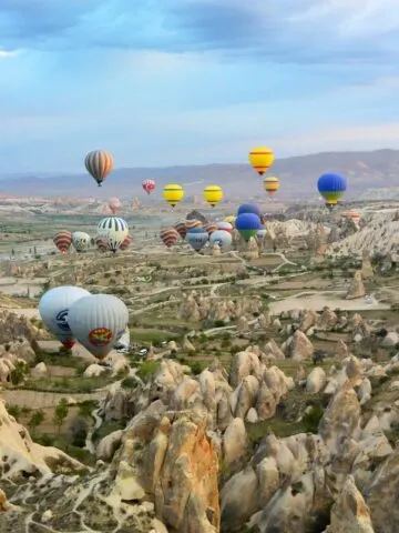 photo of assorted-color air balloon lot in mid air during daytime, Cappadocia Turkey