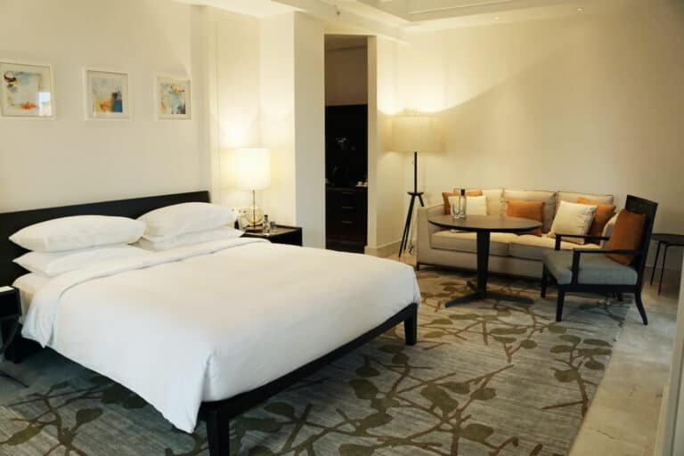 white sheet topped bed in luxury hotel room