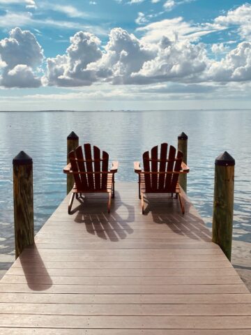 brown wooden dock on sea under blue sky during daytime, Tampa Florida