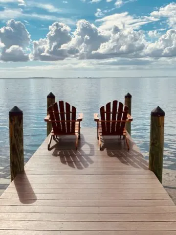 brown wooden dock on sea under blue sky during daytime, Tampa Florida