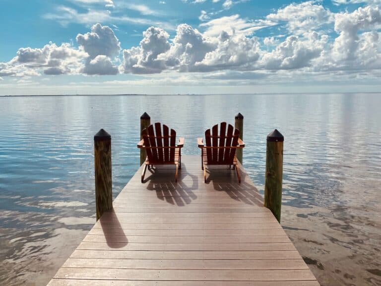 brown wooden dock on sea under blue sky during daytime, Tampa Florida