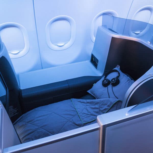 lie flat airline seat with pillow, blanket, and headset, JetBlue Mint