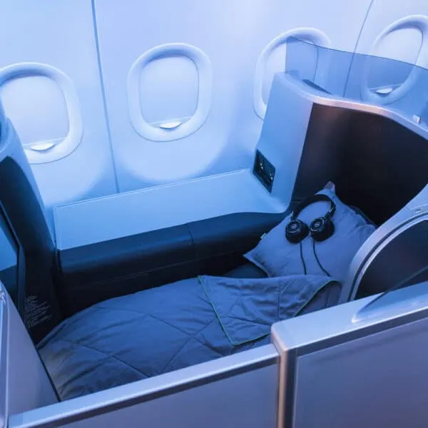 lie flat airline seat with pillow, blanket, and headset, JetBlue Mint